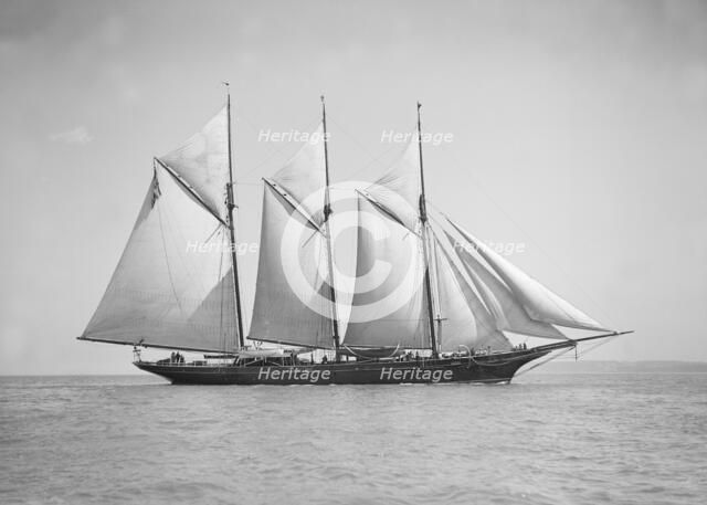 The three-mast auxiliary schooner 'Invincible', 1911. Creator: Kirk & Sons of Cowes.