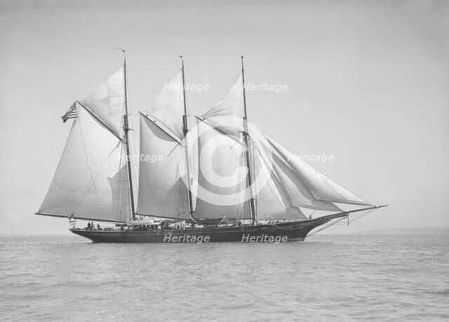 The three-mast auxiliary schooner 'Invincible', 1911. Creator: Kirk & Sons of Cowes.