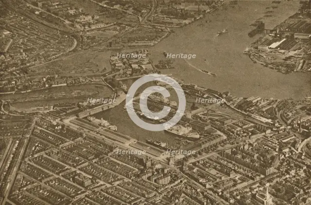 'The Three Basins of the East India Docks and the Blackwall Reach of the Thames Seen From The Air',  Creator: Aerofilms.