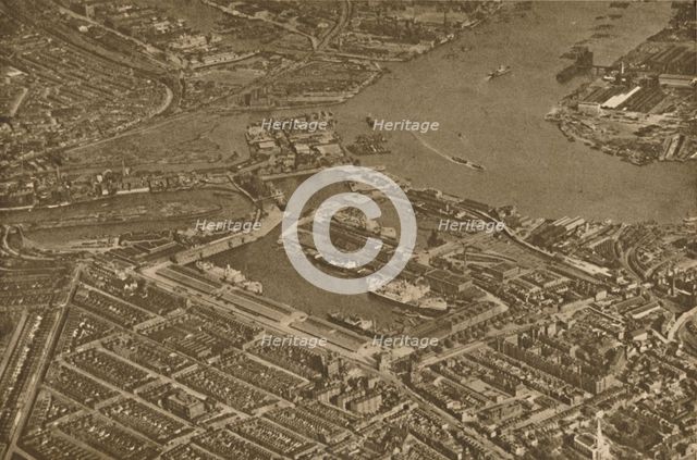 'The Three Basins of the East India Docks and the Blackwall Reach of the Thames Seen From The Air',  Creator: Aerofilms.