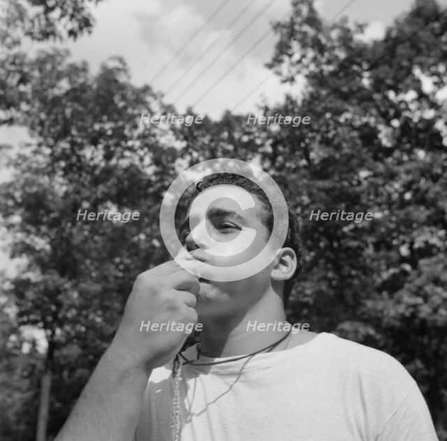 The town crier, Danny Poocchiari., Camp Nathan Hale, Southfields, New York, 1943 Creator: Gordon Parks.