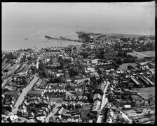 The town, looking towards the pier and Peveril Point, Swanage, 1937. Creator: Aeropictorial Ltd