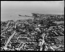 The town, looking towards the pier and Peveril Point, Swanage, 1937. Creator: Aeropictorial Ltd