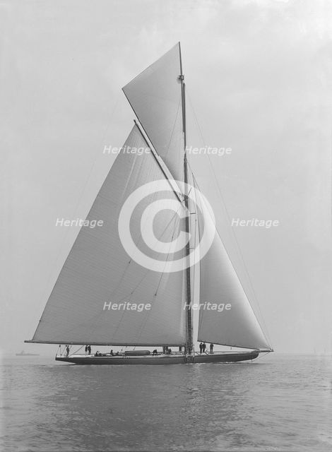 The towering 10,450 sq ft sail area of 'Shamrock IV', 1914. Creator: Kirk & Sons of Cowes.