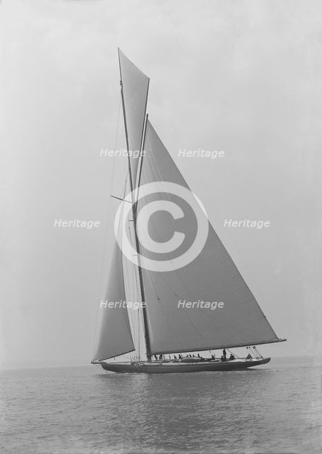 The towering 10,450 sq ft sail area of 'Shamrock IV', 1914. Creator: Kirk & Sons of Cowes.