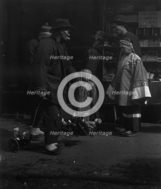 The toy peddler, Chinatown, San Francisco, between 1896 and 1906. Creator: Arnold Genthe.