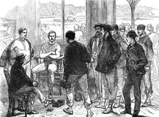 The Universities Boat-Race on the Thames: weighing the crew, 1874. Creator: Unknown