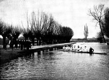 The Universities Boat-Race: the Cambridge crew at practice - a word of advice from the coach, 1895. Creator: Stearn