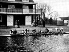 The Universities Boat-Race: the Cambridge crew at practice - putting in the boat, 1895. Creator: Stearn
