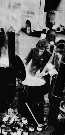 The W.V.S. Did Many Jobs. Here is a W.V.S. woman managing a field kitchen , c1941 (1942)