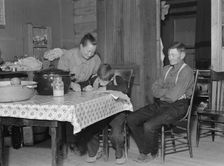 The Wardlow family in their dugout basement home on Sunday, Dead Ox Flat, Oregon, 1939. Creator: Dorothea Lange