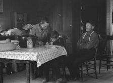 The Wardlow family in their dugout basement home on Sunday, Dead Ox Flat, Oregon, 1939. Creator: Dorothea Lange