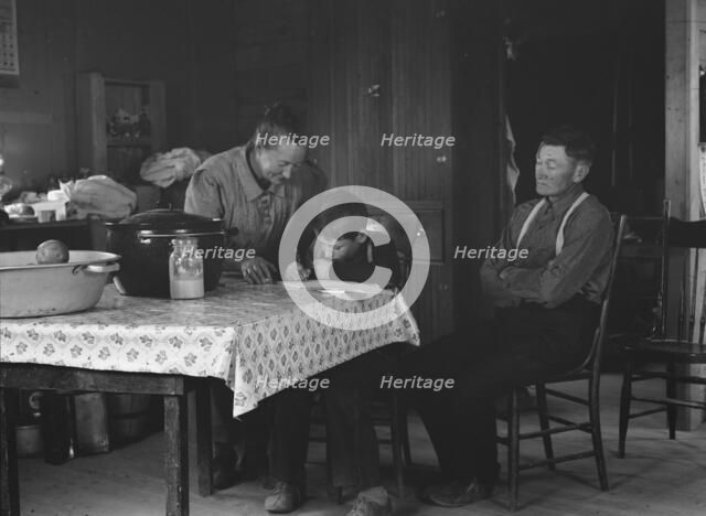 The Wardlow family in their dugout basement home on Sunday, Dead Ox Flat, Oregon, 1939. Creator: Dorothea Lange.