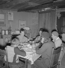 The Wardlow family in their dugout basement home, Dead Ox Flat, Malheur County, Oregon, 1939. Creator: Dorothea Lange