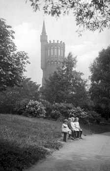 The water tower and four children on a bench in the park, Landskrona, Sweden, 1925
