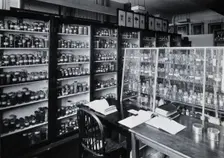 The Wellcome Building, Euston Road, London: working area in the materia medica stores, c1930s.. Creator: Unknown