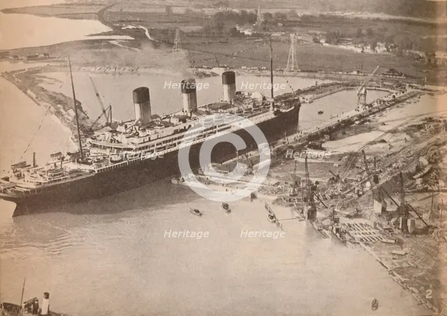 'The White Star Liner Majestic entering the world's largest graving dock at Southampton', c1934, (19 Artist: Unknown.