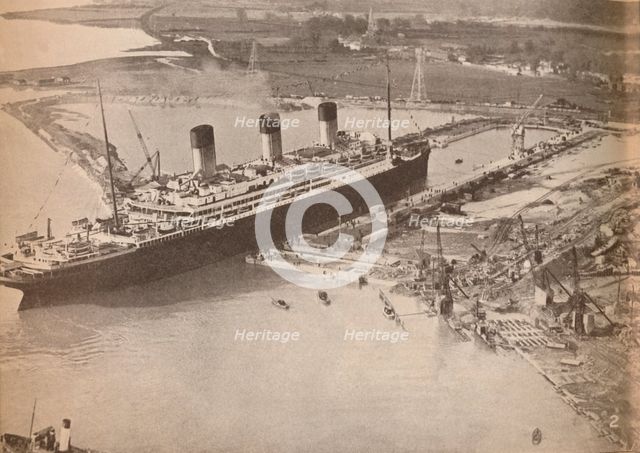 'The White Star Liner Majestic entering the world's largest graving dock at Southampton', c1934, (19 Artist: Unknown.