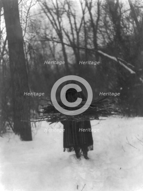The wood gatherer-Sioux, c1908. Creator: Edward Sheriff Curtis.