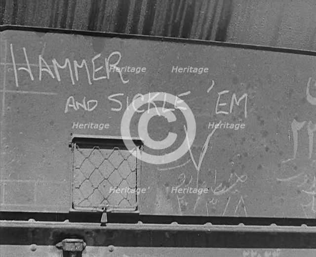 The Words: 'Hammer and Sickle ‘Em’ Written on Some Cargo, 1943. Creator: British Pathe Ltd.