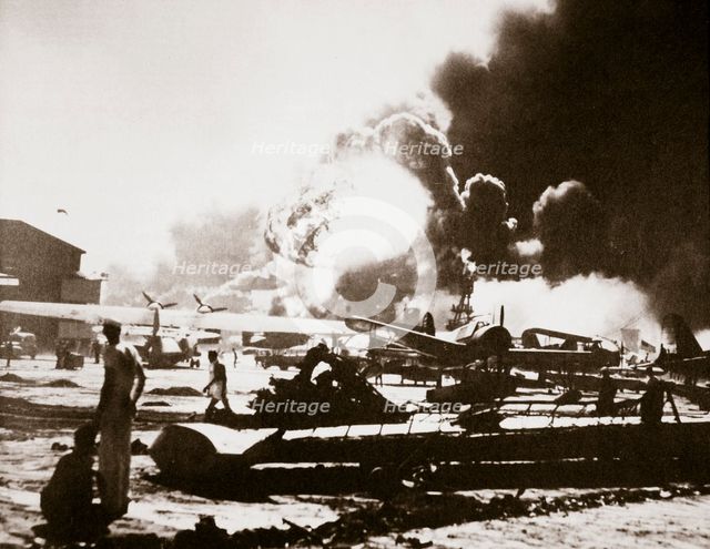 The wreckage-strewn Naval Air Station, Pearl Harbour, 7th December 1941. Artist: Unknown