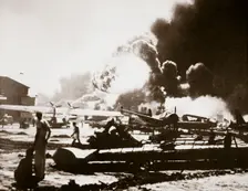 The wreckage-strewn Naval Air Station, Pearl Harbour, 7th December 1941. Creator: Unknown