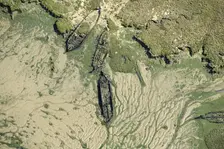The wrecks of three barges in Shepherds Creek, Chetney Marshes, Kent, 2024. Creator: Damian Grady