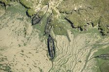 The wrecks of three barges in Shepherds Creek, Chetney Marshes, Kent, 2024. Creator: Damian Grady