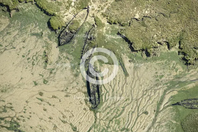 The wrecks of three barges in Shepherds Creek, Chetney Marshes, Kent, 2024. Creator: Damian Grady.