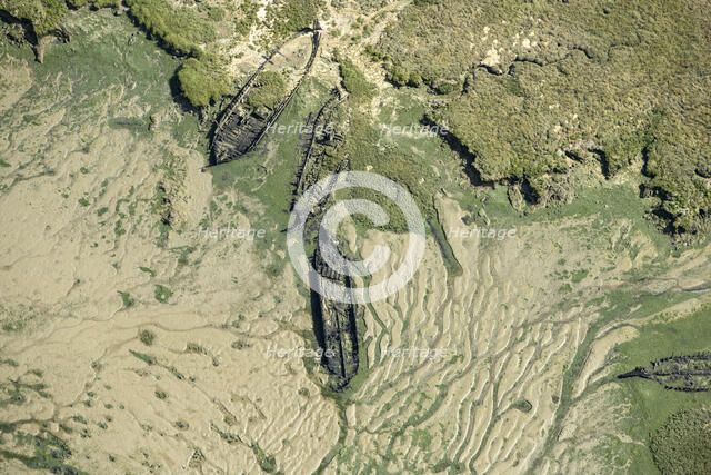 The wrecks of three barges in Shepherds Creek, Chetney Marshes, Kent, 2024. Creator: Damian Grady.