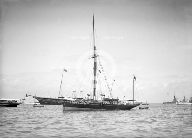 The yawl 'Beluga' at anchor, 1911. Creator: Kirk & Sons of Cowes.