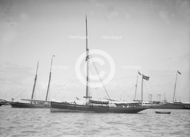 The yawl 'Beluga' at anchor, 1911. Creator: Kirk & Sons of Cowes.