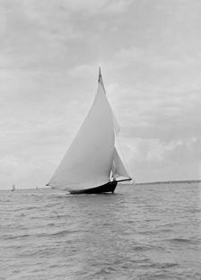 The yawl Harbinger running downwind, 1922. Creator: Kirk & Sons of Cowes