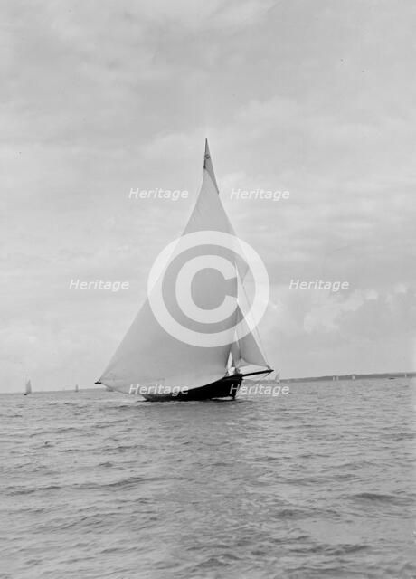 The yawl 'Harbinger' running downwind, 1922. Creator: Kirk & Sons of Cowes.