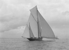 The yawl Harbinger running downwind, 1922. Creator: Kirk & Sons of Cowes