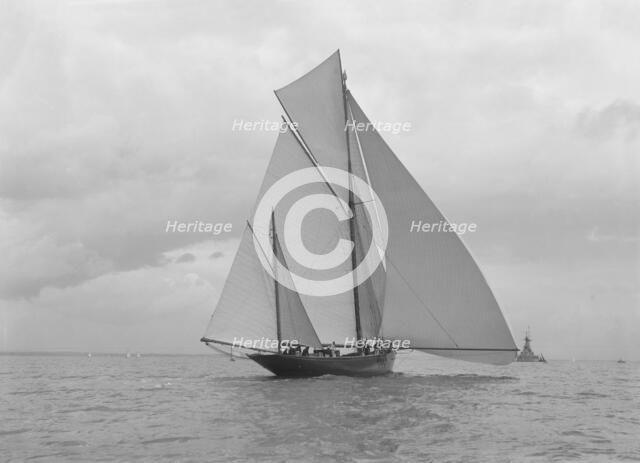 The yawl 'Harbinger' running downwind, 1922. Creator: Kirk & Sons of Cowes.