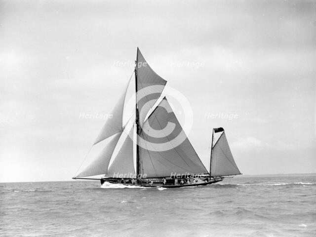 The yawl 'Joyce' sailing in good wind, 1911. Creator: Kirk & Sons of Cowes.