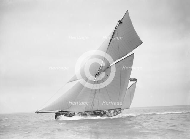 The yawl 'Joyce' sailing in good wind, 1911. Creator: Kirk & Sons of Cowes.