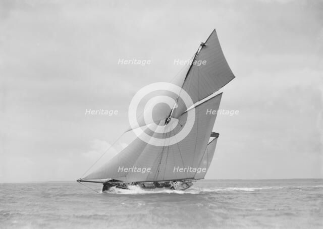 The yawl 'Joyce' sailing in good wind, 1911. Creator: Kirk & Sons of Cowes.