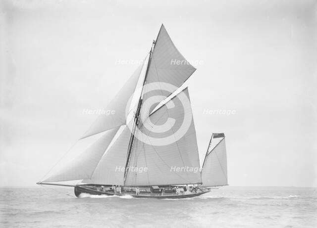 The yawl 'Joyce' sailing in good wind, 1911. Creator: Kirk & Sons of Cowes.
