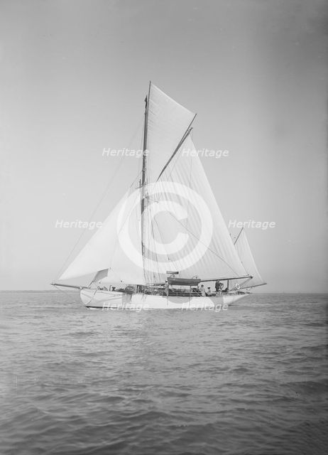 The yawl 'Suzanne' under sail, 1911. Creator: Kirk & Sons of Cowes.