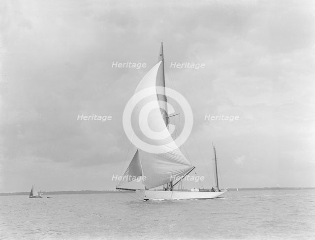 The yawl 'Sumurun' running downwind with spinnaker, 1922. Creator: Kirk & Sons of Cowes.