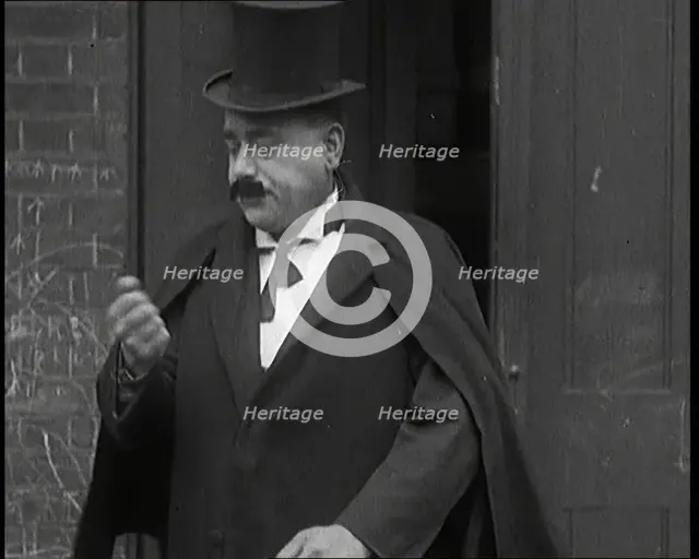 Theatre Star Billy Bennett Walking Out of a Doorway..., 1920s Creator: British Pathe Ltd.