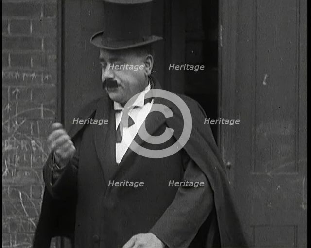 Theatre Star Billy Bennett Walking Out of a Doorway..., 1920s Creator: British Pathe Ltd.