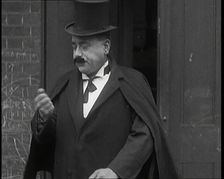 Theatre Star Billy Bennett Walking Out of a Doorway..., 1920s Creator: British Pathe Ltd