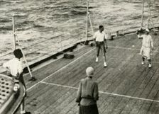 Their Majesties, in a Game of Deck Quoits on Deck of H.M.S. "Renown", 1927 1937. Creator: Unknown