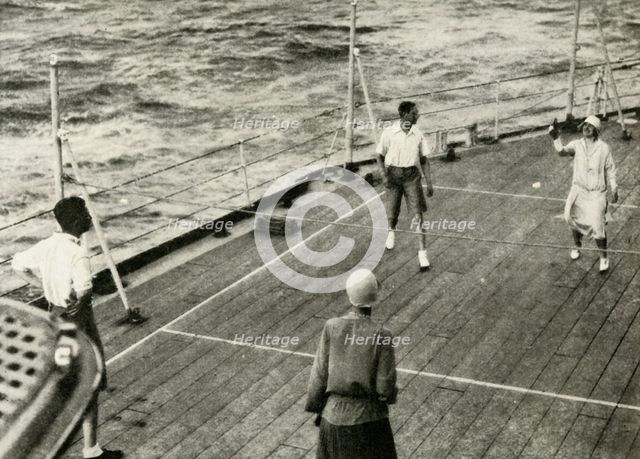 'Their Majesties, in a Game of Deck Quoits on Deck of H.M.S. "Renown", 1927', 1937. Creator: Unknown.