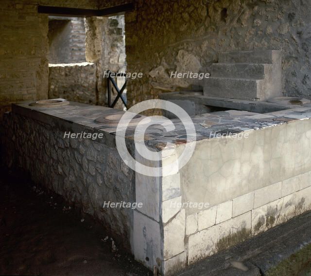 Thermopolium, commercial establishment (restaurant), Herculaneum, Italy, 2002.  Creator: LTL.