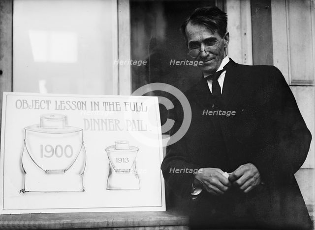 Theron Akin, Rep. from New York; with 'Full Dinner Pail' Placard, 1913. Creator: Harris & Ewing.