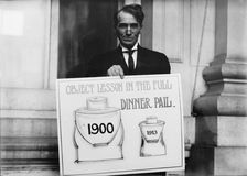 Theron Akin, Rep. from New York; with Full Dinner Pail Placard, 1913. Creator: Harris & Ewing